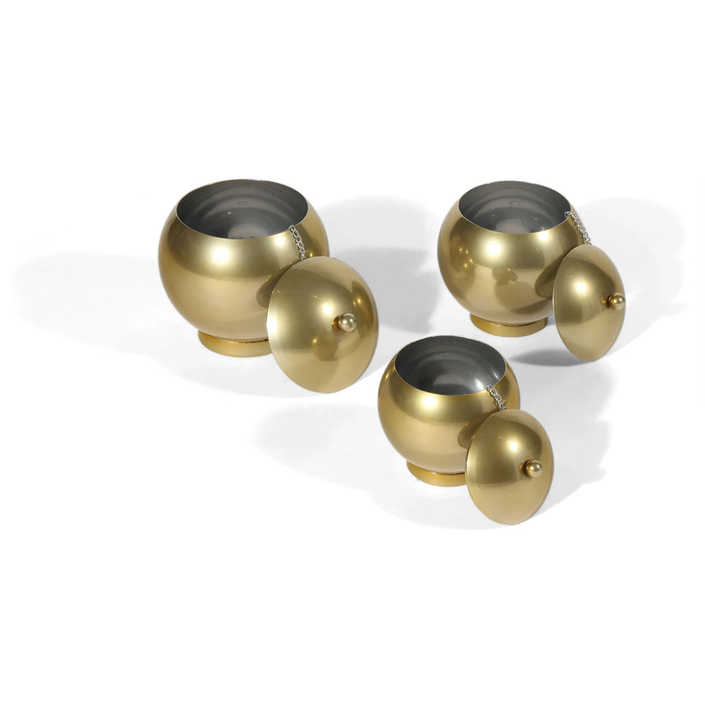 Set of Three Gold Metal Decorative Lidded Canisters